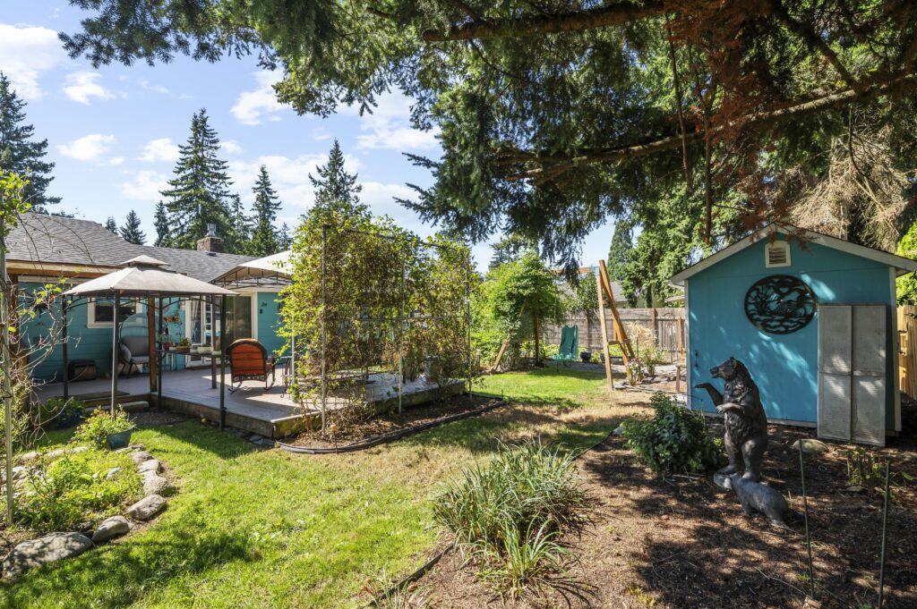 Backyard of 4619 123rd Place NE, Marysville, WA 98271 with a covered deck, shed, and garden space