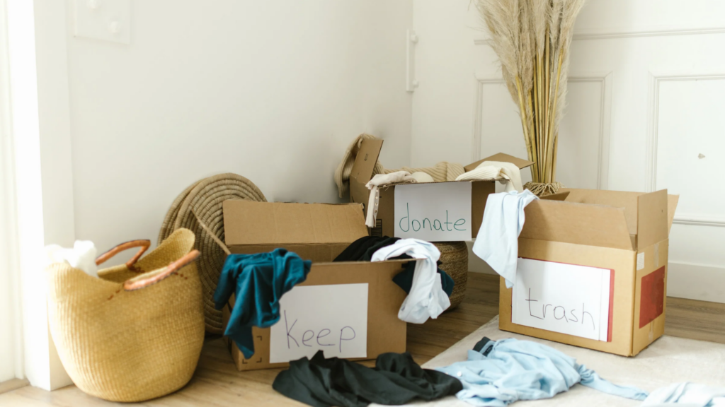 Moving boxes organized for keeping, donating and selling household belongings